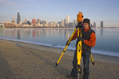 SUrveying during winter in CHicago clipart