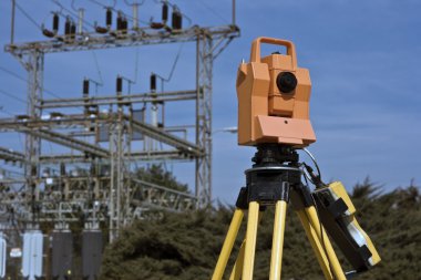 Surveying under electric wires clipart