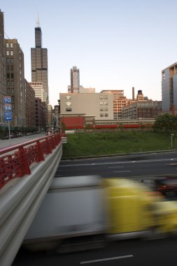 Blurred semi-truck driving in downtown Chicago clipart