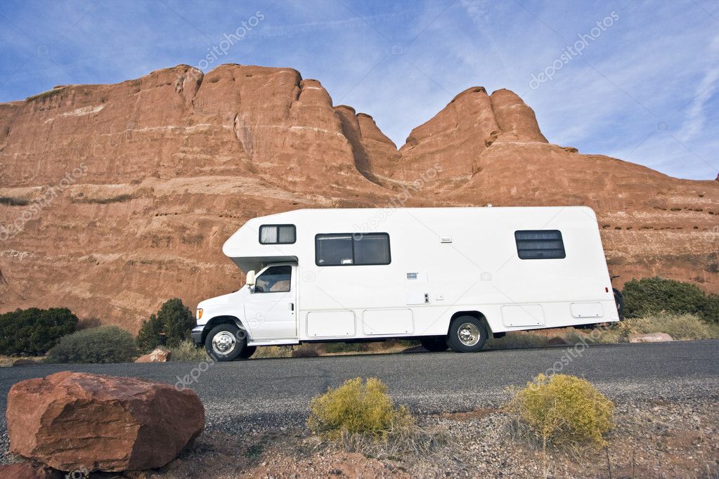 RV in front of red rocks