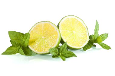 Halves of limes on mint leaves clipart