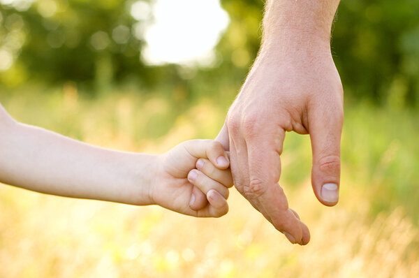 Father lead by the hand son Royalty Free Stock Images