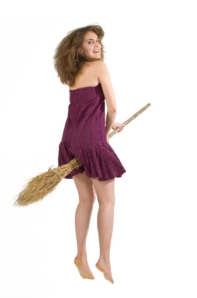 Young witch fly with broom — Stock Photo, Image