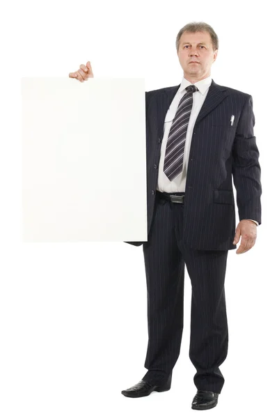 Empresário segurando papelão branco — Fotografia de Stock