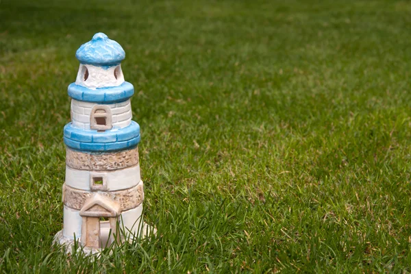 stock image Leuchtturm im Gras