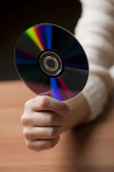 stock image Female hand holding CD