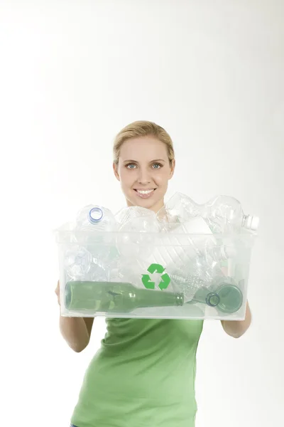 Happy young woman recycling — Stock Photo, Image