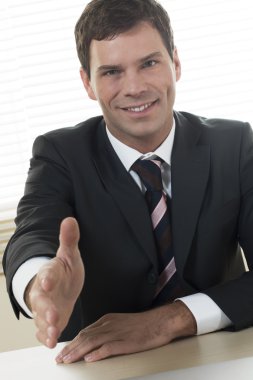 Businessman ready to shake hands clipart