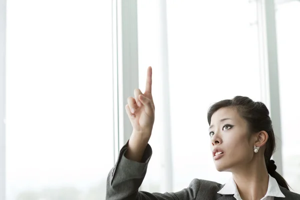 Chinese Businesswoman Pointing at Copy-space — Stock Photo, Image