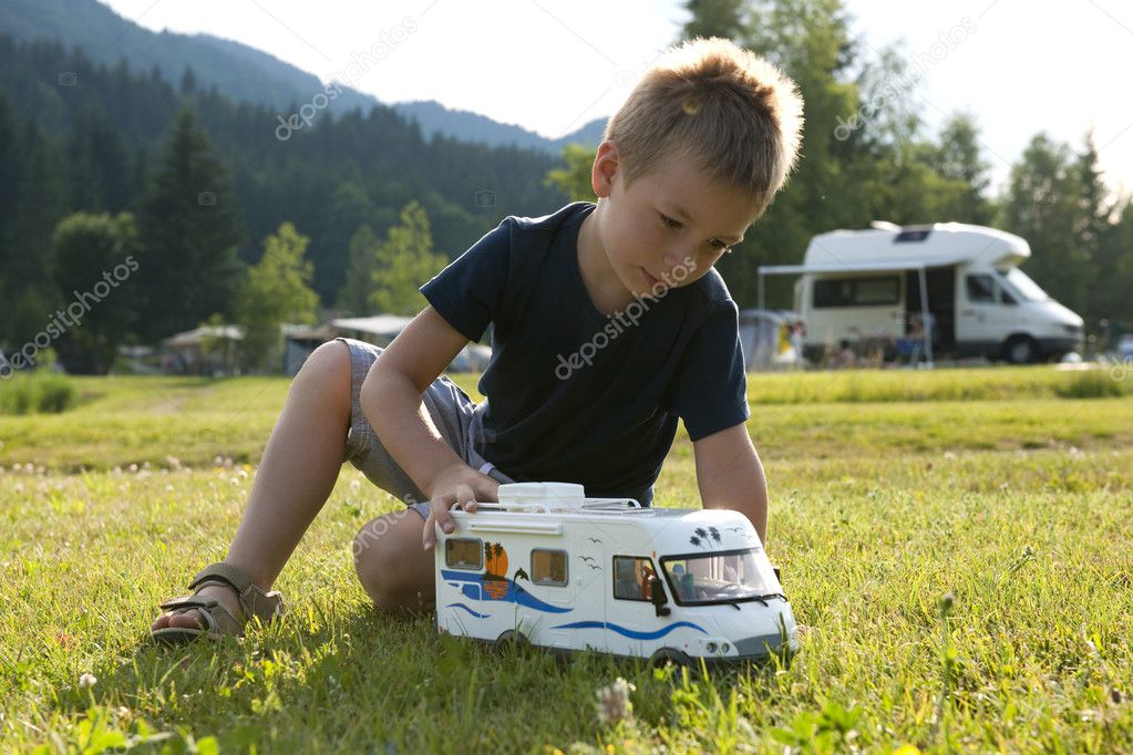 Little boy playing at camping site