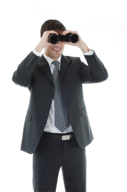 Businessman looking through a binoculars clipart