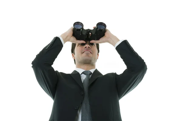 Empresário olhando através de um binóculos — Fotografia de Stock