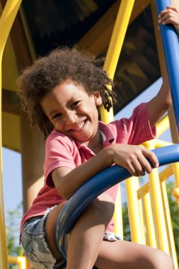 Little boy on playground clipart