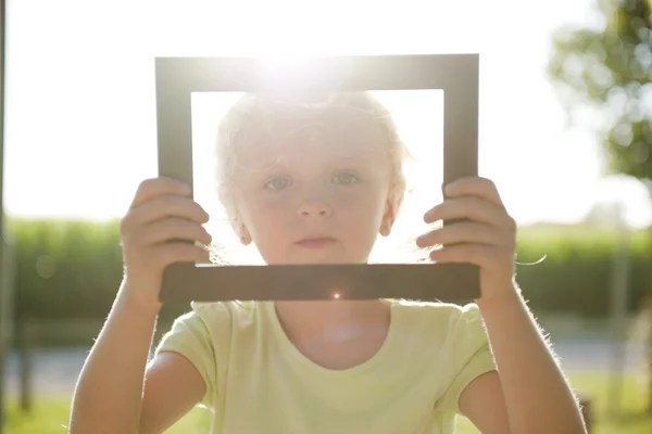 Little girl in frame — Stock Photo, Image