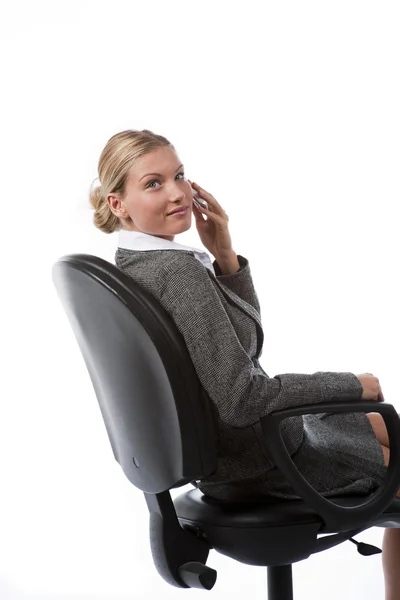 Beautiful young business woman working talking on the phone — Stock Photo, Image