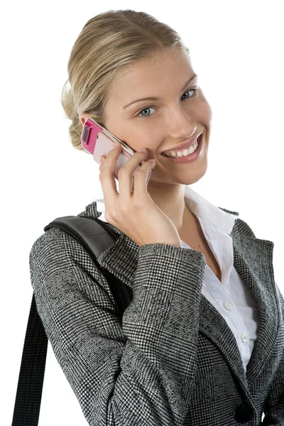 Attractive young business woman talking on a mobile phone agains — Stock Photo, Image