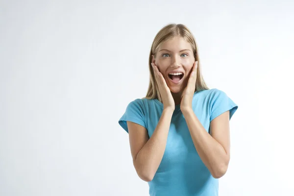 Close-up of a young woman looking excited — Stock Photo, Image