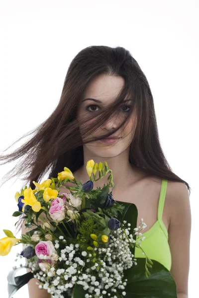 Beauty with a bunch of flowers — Stock Photo, Image