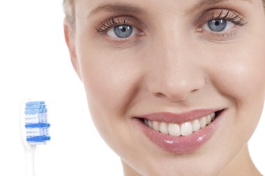 Smiling young woman with toothbrush clipart