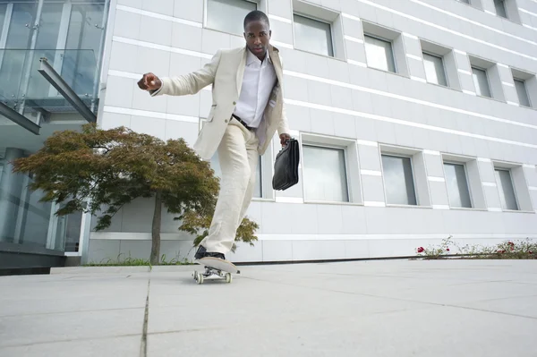 Businessman on skateboard — Stock Photo, Image