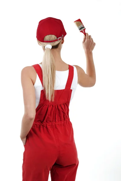 Rear view of a young woman painting — Stock Photo, Image