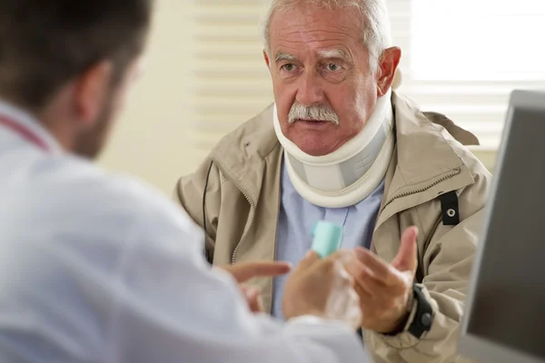 Senior man at the doctor — Stock Photo, Image