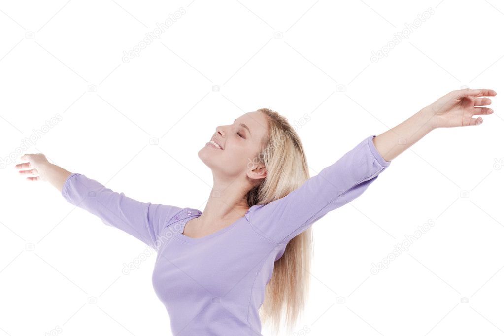 Beautiful young woman with arms raised