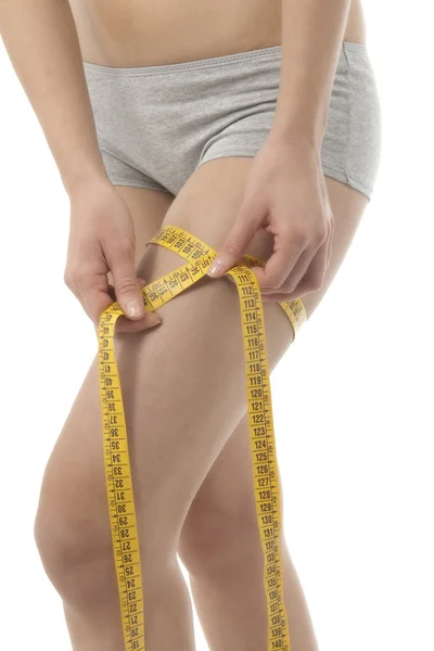 Woman measuring her thigh — Stock Photo, Image
