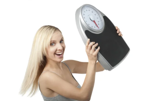 Spokojená žena zvedá váhu — Stock fotografie