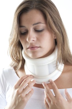 Painful Woman Wearing Cervical Collar clipart