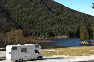 RV Parked At The Lake clipart