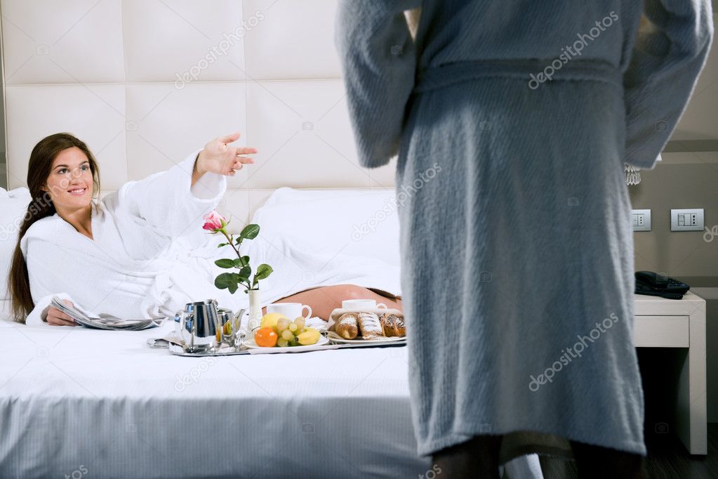 Woman having breakfast in bad