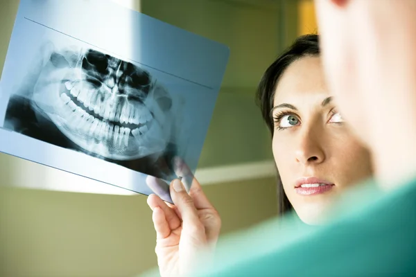 stock image Two Dentists examining x-ray
