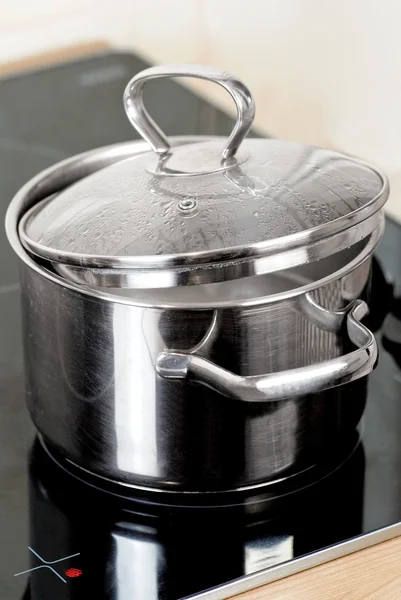 Metal pot on the stove — Stock Photo, Image
