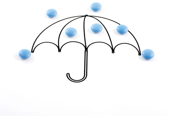 Umbrella and pills — Stock Photo, Image
