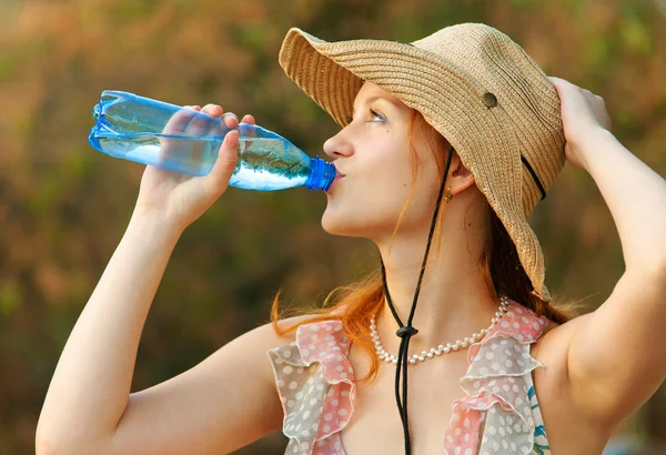 stock image Beautiful girl drinks water