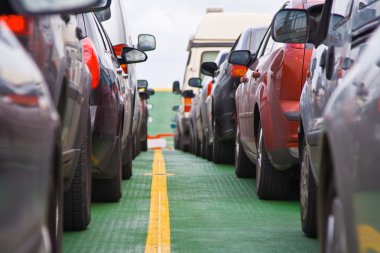 Cars parked on the ferry clipart