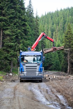 Truck loading wood clipart