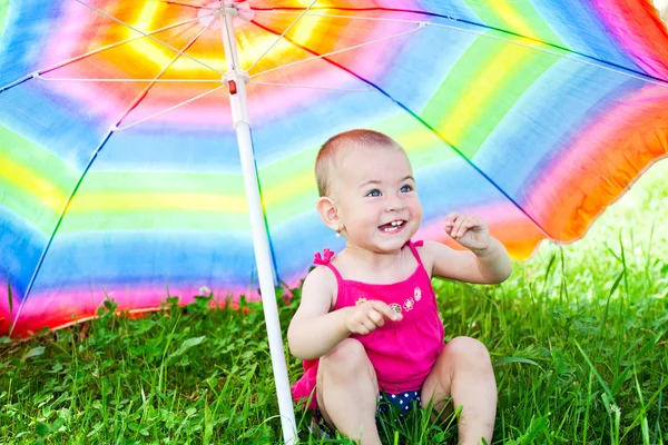 stock image Hiding under a colorful umbrella