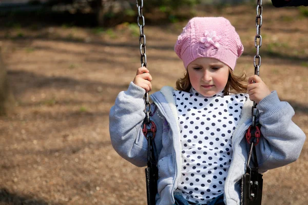 Little girl in the swing — Stock Photo, Image