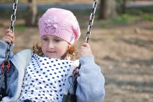 Little girl in the swing — Stock Photo, Image