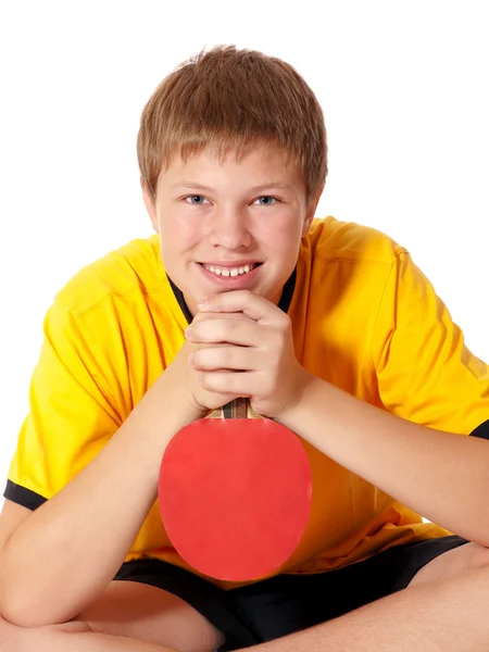 Portrét dospívající v žluté tričko s ping pong raketa — Stock fotografie
