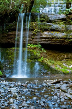 Waterfall in deep forest clipart