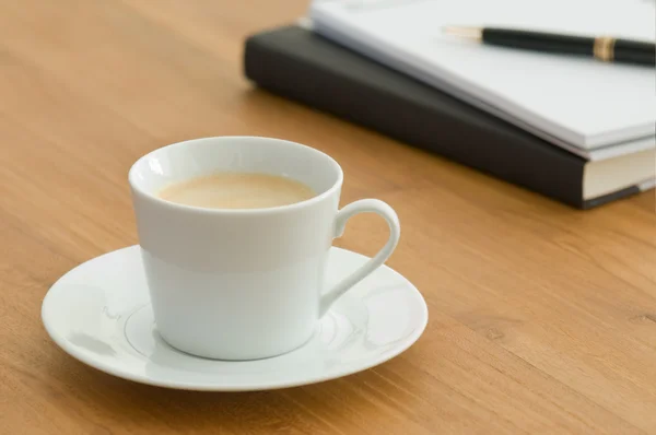 White coffee cup in a business setting — Stock Photo, Image