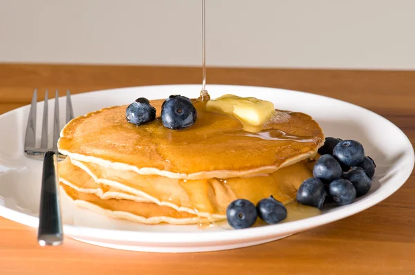 Blueberry pancakes on a plate with fork — Stock Photo, Image