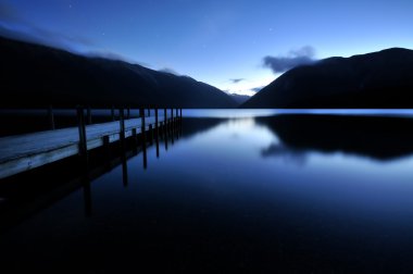 Serene reflection on evening lake Rotoiti, Nelson Lakes National Park clipart