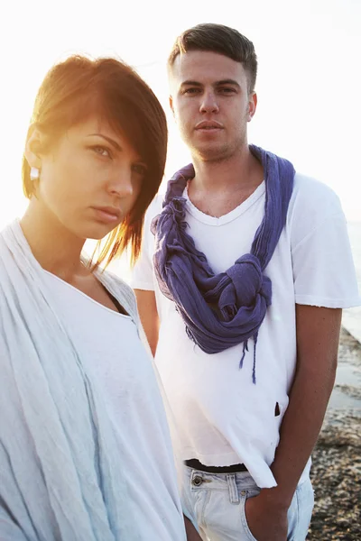 stock image Lovely couple standing on the beach