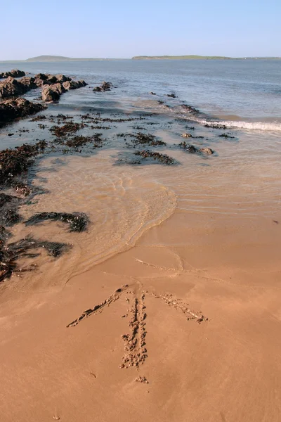 Flèche dans le sable — Photo