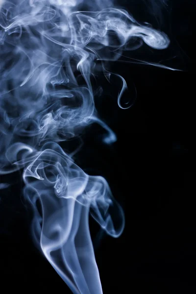 Stream of a blue smoke on a black background — Stock Photo, Image