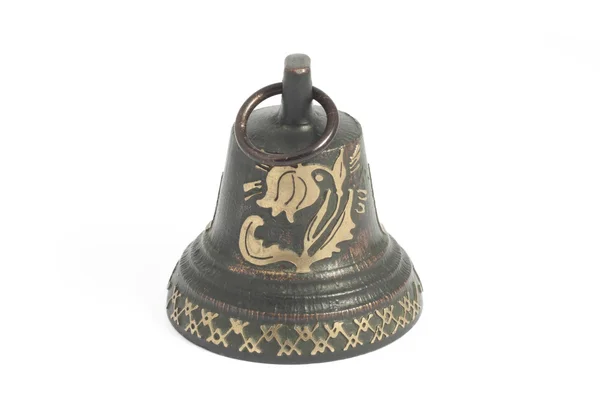 Pequeña campana de bronce en blanco —  Fotos de Stock